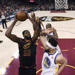 Cleveland Cavaliers' Tristan Thompson shoots against Golden State Warriors' JaVale McGee during the first half of Game 4 of basketball's NBA Finals, Friday, June 8, 2018, in Cleveland. (Gregory Shamus/Pool Photo via AP)
