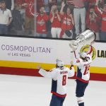 Washington Capitals center Nicklas Backstrom, right, of Sweden, carries the Stanley Cup as he skates with left wing Alex Ovechkin, of Russia, after the Capitals defeated the Golden Knights 4-3 in Game 5 of the NHL hockey Stanley Cup Finals Thursday, June 7, 2018, in Las Vegas. (AP Photo/Ross D. Franklin)