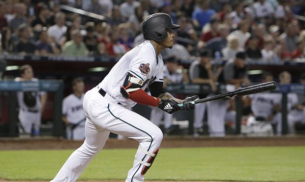 Arizona Diamondbacks' Ketel Marte watches his two-run triple during the first inning of the team's ...