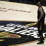 Cleveland Cavaliers' LeBron James watches during the first half of Game 4 of basketball's NBA Finals against the Golden State Warriors, Friday, June 8, 2018, in Cleveland. (AP Photo/Tony Dejak)