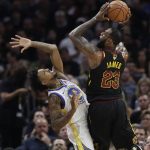 Cleveland Cavaliers' LeBron James shoots over Golden State Warriors' Nick Young during the first half of Game 4 of basketball's NBA Finals, Friday, June 8, 2018, in Cleveland. (AP Photo/Tony Dejak)