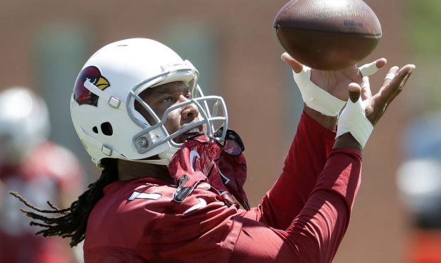Arizona Cardinals ' Larry Fitzgerald (11) makes a catch during practice at the NFL football team's ...