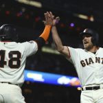 San Francisco Giants' Hunter Pence, right, celebrates with Pablo Sandoval (48) after both scored against the Arizona Diamondbacks in the fourth inning of a baseball game Monday, June 4, 2018, in San Francisco. Both scored on a double by Giants' Alen Hanson. (AP Photo/Ben Margot)