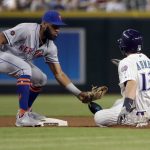 Arizona Diamondbacks' Nick Ahmed (13) is caught stealing by New York Mets Amed Rosario during the first inning of a baseball game Thursday, June 14, 2018, in Phoenix. (AP Photo/Matt York)
