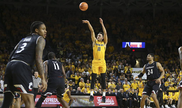 Wichita State guard Landry Shamet hits a three-pointer against Cincinnati during the first half of ...