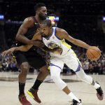 Cleveland Cavaliers forward Jeff Green defends against Golden State Warriors' Kevin Durant during the first half of Game 4 of basketball's NBA Finals, Friday, June 8, 2018, in Cleveland. (AP Photo/Tony Dejak)