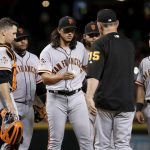 San Francisco Giants starting pitcher Dereck Rodriguez is pulled from the baseball game against the Arizona Diamondbacks by manager Bruce Bochy during the seventh inning Saturday, June 30, 2018, in Phoenix. (AP Photo/Matt York)