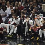 Cleveland Cavaliers players watch from the bench during the second half of Game 4 of basketball's NBA Finals against the Golden State Warriors, Friday, June 8, 2018, in Cleveland. (AP Photo/Tony Dejak)