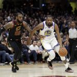 Golden State Warriors' Kevin Durant goes to the basket against Cleveland Cavaliers' LeBron James during the first half of Game 4 of basketball's NBA Finals, Friday, June 8, 2018, in Cleveland. (AP Photo/Tony Dejak)