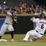 Arizona Diamondbacks' David Peralta (6) is forced out by Pittsburgh Pirates' Josh Harrison (5) on a base hit by Ketel Marte during the second inning of a baseball game, Monday, June 11, 2018, in Phoenix. (AP Photo/Matt York)