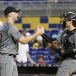 Arizona Diamondbacks relief pitcher Brad Boxberger, left, and catcher John Ryan Murphy congratulate each other after the Diamondbacks defeated the Miami Marlins 5-3 during a baseball game Tuesday, June 26, 2018, in Miami. (AP Photo/Wilfredo Lee)