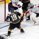 Vegas Golden Knights right wing Reilly Smith, left, scores on Washington Capitals goaltender Braden Holtby during the second period in Game 5 of the NHL hockey Stanley Cup Finals on Thursday, June 7, 2018, in Las Vegas. (AP Photo/Ross D. Franklin)