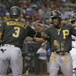 Pittsburgh Pirates' Starling Marte celebrates with Sean Rodriguez (3) after hitting a three-run home run against the Arizona Diamondbacks during the fourth inning of a baseball game Tuesday, June 12, 2018, in Phoenix. (AP Photo/Rick Scuteri)