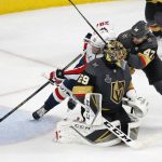 Washington Capitals center Lars Eller (20) scores on Vegas Golden Knights goaltender Marc-Andre Fleury, front, while under pressure from defenseman Luca Sbisa during the third period in Game 5 of the NHL hockey Stanley Cup Finals Thursday, June 7, 2018, in Las Vegas. (AP Photo/Ross D. Franklin)
