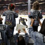 Player family members, from left, Alexandra Marchessault and her daughter Victoria Marchessault, 2, watch players warm up, along with Victoria Fleury, 2, and Veronique Fleury prior to Game 5 of the team's NHL hockey Stanley Cup Finals against the Washington Capitals on Thursday, June 7, 2018, in Las Vegas. The child at center is unidentified. (AP Photo/John Locher)