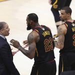 Cleveland Cavaliers' LeBron James (23) talks with coach Tyronn Lue during the second half of Game 4 of basketball's NBA Finals against the Golden State Warriors, Friday, June 8, 2018, in Cleveland. (AP Photo/Carlos Osorio)