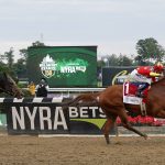 Justify (1), with jockey Mike Smith up, crosses the finish line ahead of Gronkowski (6), with jockey Jose Ortiz up, to win the 150th running of the Belmont Stakes horse race and the Triple Crown, Sunday, June 10, 2018, in Elmont, N.Y. (AP Photo/Julie Jacobson)