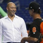 Miami Marlins CEO Derek Jeter, left, laughs as he talks with manager Don Mattingly during batting practice before the team's baseball game against the Arizona Diamondbacks, Wednesday, June 27, 2018, in Miami. (AP Photo/Wilfredo Lee)