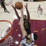 Cleveland Cavaliers' Tristan Thompson (13) and Golden State Warriors' JaVale McGee reach for a rebound during the second half of Game 4 of basketball's NBA Finals, Friday, June 8, 2018, in Cleveland. (Kyle Terada/Pool Photo via AP)