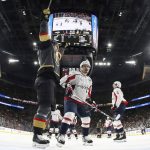 Vegas Golden Knights center William Karlsson, left, celebrates a goal by defenseman Nate Schmidt as Washington Capitals defenseman Dmitry Orlov skates past during the second period in Game 5 of the NHL hockey Stanley Cup Finals on Thursday, June 7, 2018, in Las Vegas. (Harry How/Pool via AP)