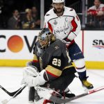 Vegas Golden Knights goaltender Marc-Andre Fleury, below, stops a shot as Washington Capitals left wing Alex Ovechkin, of Russia, stands next to him during the first period in Game 5 of the NHL hockey Stanley Cup Finals on Thursday, June 7, 2018, in Las Vegas. (AP Photo/John Locher)