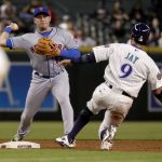 Arizona Diamondbacks' Jon Jay (9) is forced out by New York Mets' Asdrubal Cabrera on a double play hit into by Nick Ahmed during the third inning of a baseball game Thursday, June 14, 2018, in Phoenix. (AP Photo/Matt York)