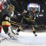 Vegas Golden Knights goaltender Marc-Andre Fleury, left, and defenseman Nate Schmidt defend their goal during the first period in Game 5 of the NHL hockey Stanley Cup Finals on Thursday, June 7, 2018, in Las Vegas. (Harry How/Pool via AP)