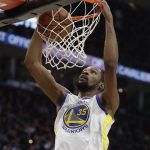 Golden State Warriors' Kevin Durant dunks during the first half of Game 4 of basketball's NBA Finals against the Cleveland Cavaliers, Friday, June 8, 2018, in Cleveland. (AP Photo/Tony Dejak)