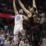Golden State Warriors' Stephen Curry shoots over Cleveland Cavaliers' Larry Nance Jr. during the first half of Game 4 of basketball's NBA Finals, Friday, June 8, 2018, in Cleveland. (AP Photo/Tony Dejak)