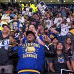 Fans react while watching the broadcast of the Golden State Warriors playing the Cleveland Cavaliers in Game 4 of the NBA Finals, at Oracle Arena in Oakland, Calif., Friday, June 8, 2018. (AP Photo/Josh Edelson)