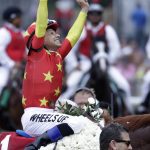 Jockey Mike Smith reacts after guiding Justify to win the 150th running of the Belmont Stakes horse race, Saturday, June 9, 2018, in Elmont, N.Y. (AP Photo/Julio Cortez)