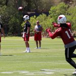 QB Sam Bradford connects with WR Larry Fitzgerald during Thursday's OTAs. (Tyler Drake/Arizona Sports)