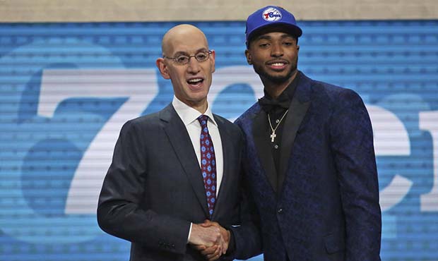 Villanova's Mikal Bridges, right, poses with NBA Commissioner Adam Silver after he was picked 10th ...