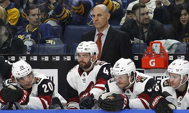 Arizona Coyotes coach Rick Tocchet watches during the second period of the team's NHL hockey game a...