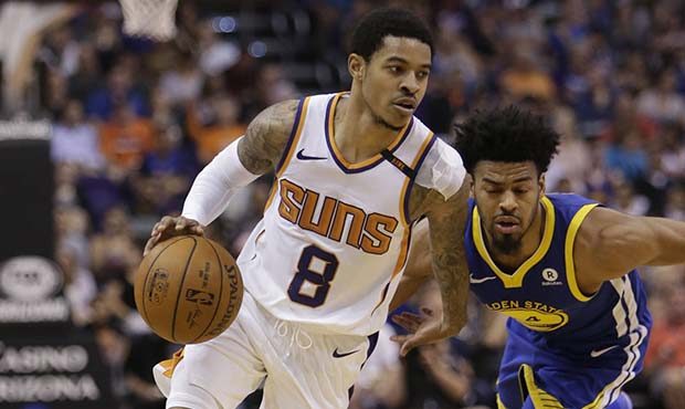 Phoenix Suns guard Tyler Ulis (8) drives past Golden State Warriors guard Quinn Cook in the second ...