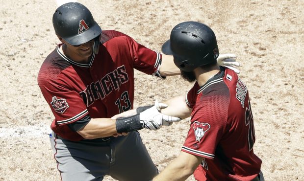 Arizona Diamondbacks' Nick Ahmed, left, is greeted by teammate Steven Souza Jr. after hitting a two...