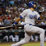 Los Angeles Dodgers right fielder Andre Ethier (16) follows through on a single during the first inning of a baseball game against the Arizona Diamondbacks, Saturday, Sept. 12, 2015, in Phoenix. (AP Photo/Matt York)