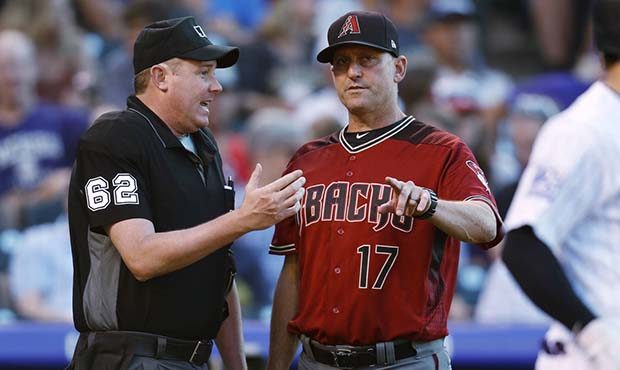 Home plate umpire Chad Whitson, left, confers with Arizona Diamondbacks manager Torey Lovullo in th...