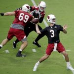 Arizona Cardinals quarterback Josh Rosen (3) throws during the first day of NFL football training camp, Saturday, July 28, 2018, in Glendale, Ariz. (AP Photo/Matt York)