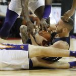 Phoenix Suns' Alec Peters, left, and Dallas Mavericks' Mitchell Creek scramble for the ball during the first half of an NBA summer league basketball game Friday, July 6, 2018, in Las Vegas. (AP Photo/John Locher)