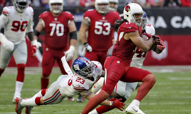 Arizona Cardinals wide receiver Larry Fitzgerald (11) eludes the reach of New York Giants defensive...