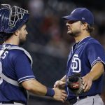 San Diego Padres relief pitcher Brad Hand, right, celebrates with catcher Austin Hedges after the team's 6-3 win in a baseball game against the Arizona Diamondbacks on Thursday, July 5, 2018, in Phoenix. (AP Photo/Ross D. Franklin)