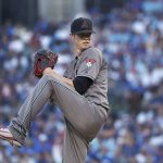 Arizona Diamondbacks starting pitcher Clay Buchholz winds up during the first inning of the team's baseball game against the Chicago Cubs on Tuesday, July 24, 2018, in Chicago. (AP Photo/Charles Rex Arbogast)