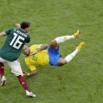 Brazil's Neymar, right, challenges for the ball with Mexico's Hector Herrera during the round of 16 match between Brazil and Mexico at the 2018 soccer World Cup in the Samara Arena, in Samara, Russia, Monday, July 2, 2018. (AP Photo/Sergei Grits)