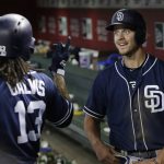 San Diego Padres' Wil Myers celebrates with Freddy Galvis (13) after hitting a solo home run against the Arizona Diamondbacks in the 16th inning during a baseball game, Sunday, July 8, 2018, in Phoenix. (AP Photo/Rick Scuteri)