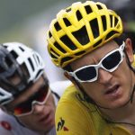 Britain's Chris Froome, left, follows teammate Britain's Geraint Thomas, wearing the overall leader's yellow jersey, as they climb Col du Tourmalet pass during the nineteenth stage of the Tour de France cycling race over 200.5 kilometers (124.6 miles) with start in Lourdes and finish in Laruns, France, Friday July 27, 2018. (AP Photo/Christophe Ena )