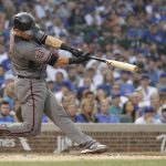 Arizona Diamondbacks' Jeff Mathis hits a two-run double off Chicago Cubs relief pitcher Luke Farrell during the first inning of a baseball game Monday, July 23, 2018, in Chicago. Ketel Marte and Daniel Descalso scored. (AP Photo/Charles Rex Arbogast)