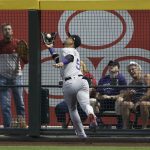 Colorado Rockies outfielder Carlos Gonzalez makes a catch at the warning track on a fly ball hit by Arizona Diamondbacks' John Ryan Murphy during the fourth inning of a baseball game Saturday, July 21, 2018, in Phoenix. (AP Photo/Ralph Freso)