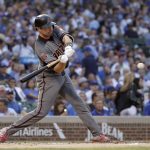 Arizona Diamondbacks' A.J. Pollock swings into an RBI single off Chicago Cubs pitcher Luke Farrell during the first inning of a baseball game Monday, July 23, 2018, in Chicago. Jon Jay scored. (AP Photo/Charles Rex Arbogast)