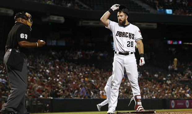 Arizona Diamondbacks' Steven Souza Jr., right, pauses after being called out on strikes by home pla...